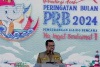 Plh. Sekda Aceh, Azwardi, AP, M.Si, saat menyampaikan sambutan Pj Gubernur Aceh sekaligus membuka kegiatan Peringatan Bulan Pengurangan Risiko Bencana (PRB) Nasional 2024,/ foto ist